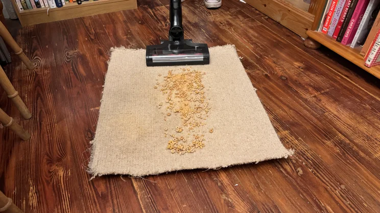 The Miele Triflex HX3 cleaning Cheerios from carpet
