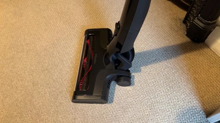 The Miele Triflex HX3, vacuuming a beige carpet