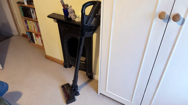 The Miele Triflex HX3 with the motor at the top, leaning against a cupboard