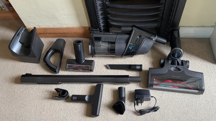 The Miele Triflex HX3's accessories laid out on the floor