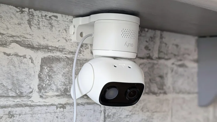 The Eufy Wired Cam C1 security camera attached to its bracket and installed upside down on the ceiling