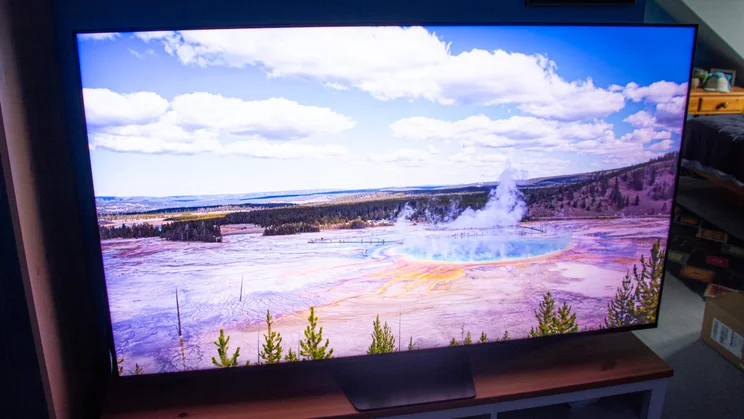 The Hisense UR8S RGB Mini LED TV displaying an image of a geothermal pool in Dynamic Mode