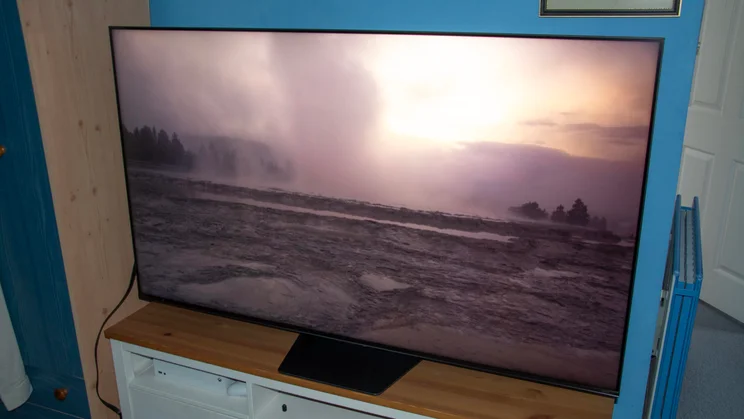 The Hisense UR8S RGB Mini LED TV displaying an image of a glacial landscape in Filmmaker Mode