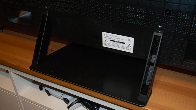 Rear view of the pedestal stand of the Hisense UR8S RGB Mini LED TV