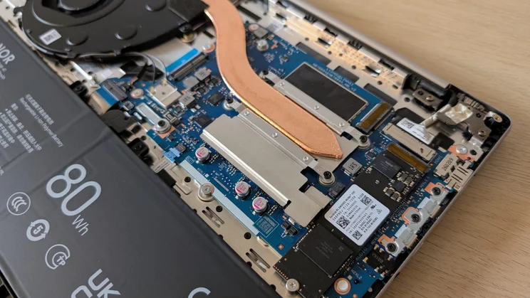 Close-up of the the Honor MagicBook 16 laptop with its base plate removed showing the SSD