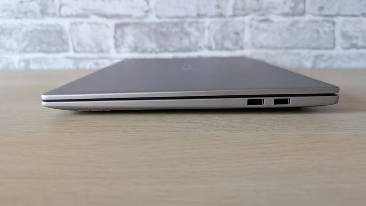 Side view of the Honor MagicBook 16 laptop with its lid closed showing its two USB-A ports