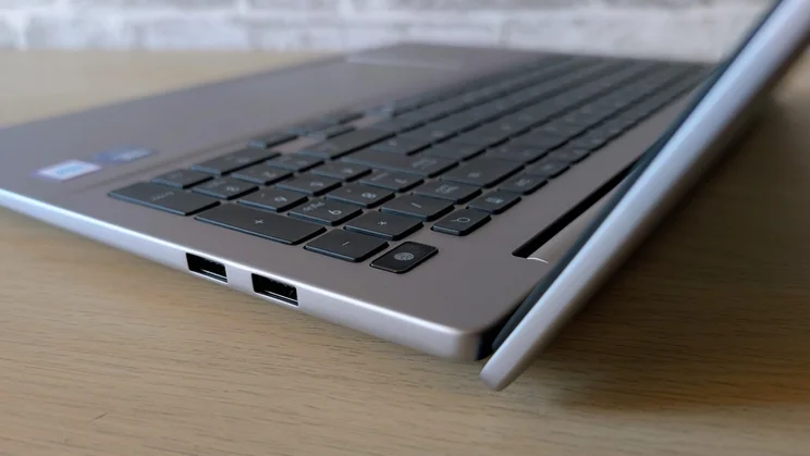 Side view of the Honor MagicBook 16 laptop with its lid open showing the two USB-A ports