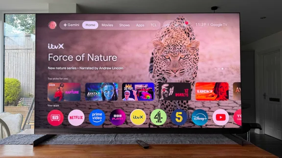 Front view of the TCL X11L SQD Mini LED TV displaying the Google TV homepage