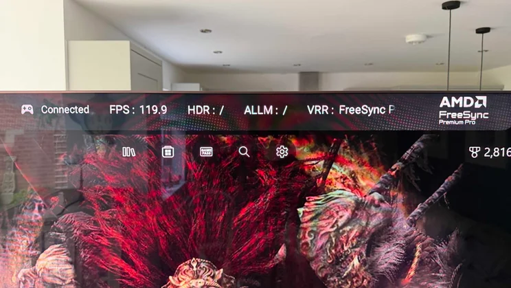 The game input details displayed at the top of the screen on the TCL X11L SQD Mini LED TV