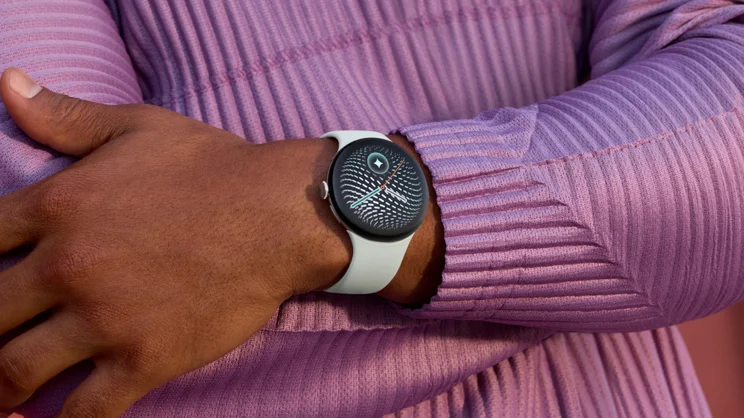 The Pixel Watch 5 in Fog being worn on the wrist