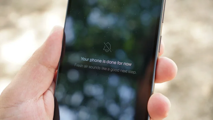 Balance Phone in hand, displaying a suggestion to take a break from screens