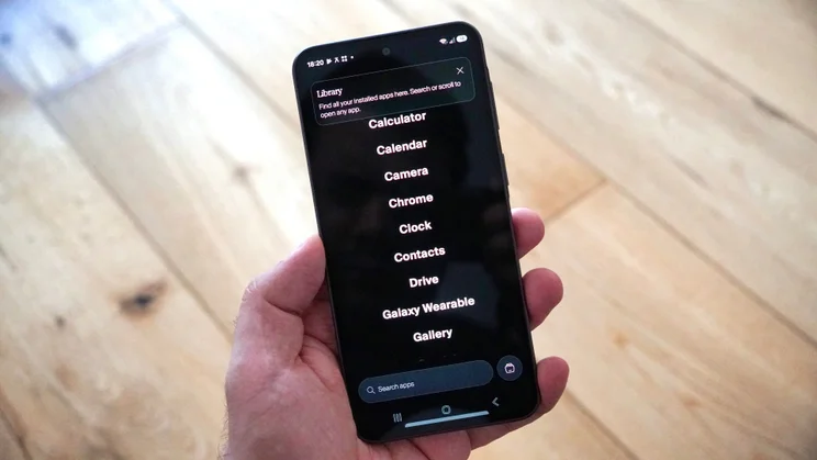Balance Phone in hand, displaying app options