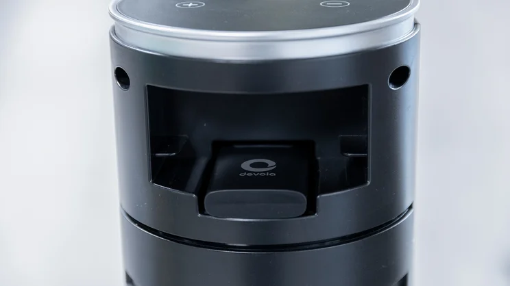 A closeup of the Devola Platinum 38in DC Tower Fan's remote control storage slot