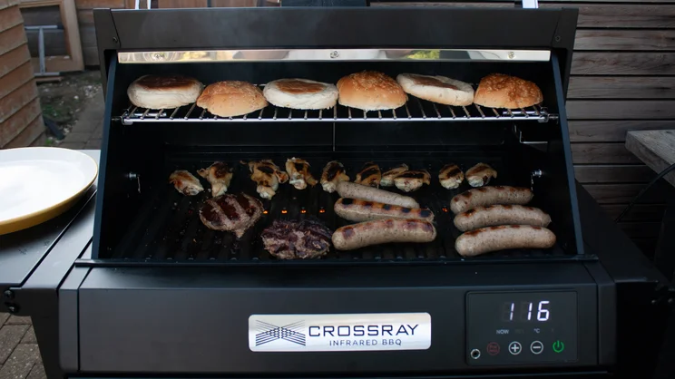 Meats and buns cooking on the Dimplex Crossray eXtreme BBQ