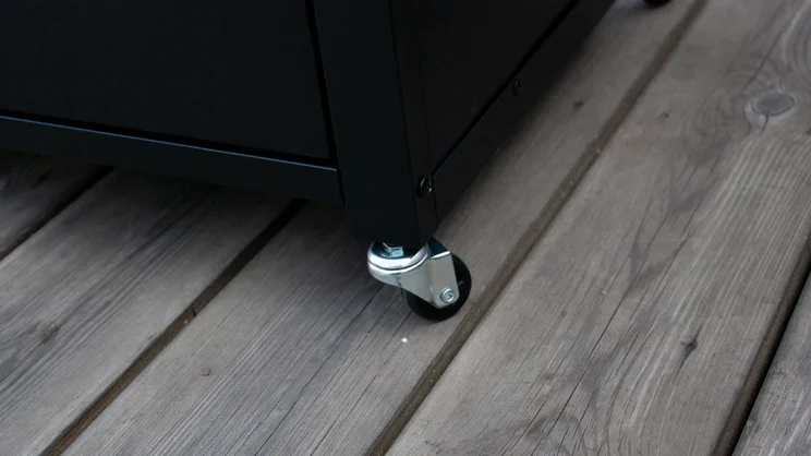 A closeup of the Dimplex Crossray eXtreme BBQ's stand wheel