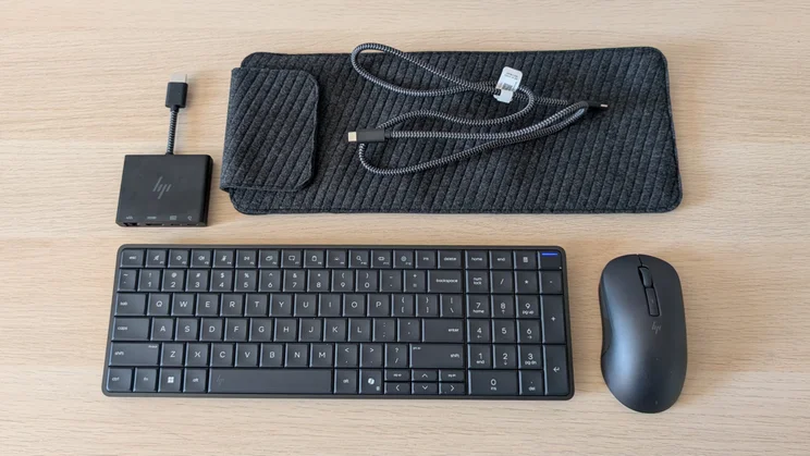 HP EliteBoard G1a review - keyboard mouse carry case cables and adapters arrayed on wood table