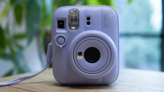The Instax Mini 13 instant camera on a table in an office