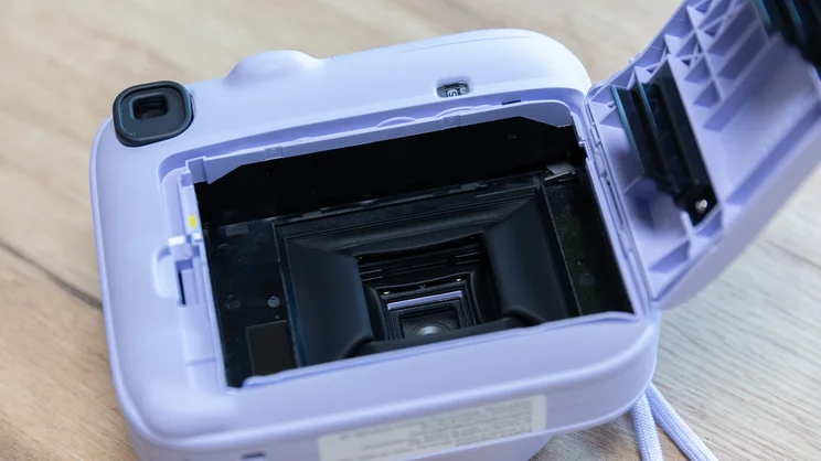 The Instax Mini 13 instant camera's film compartment, open