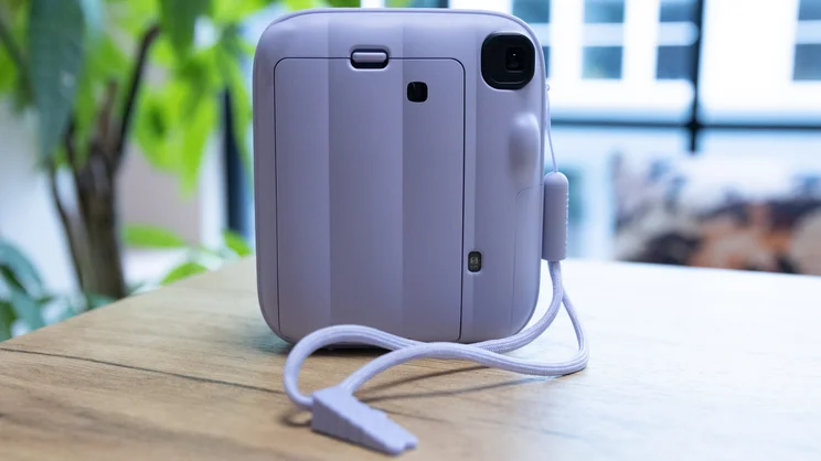The back on the Instax Mini 13 instant camera, on a table in an office