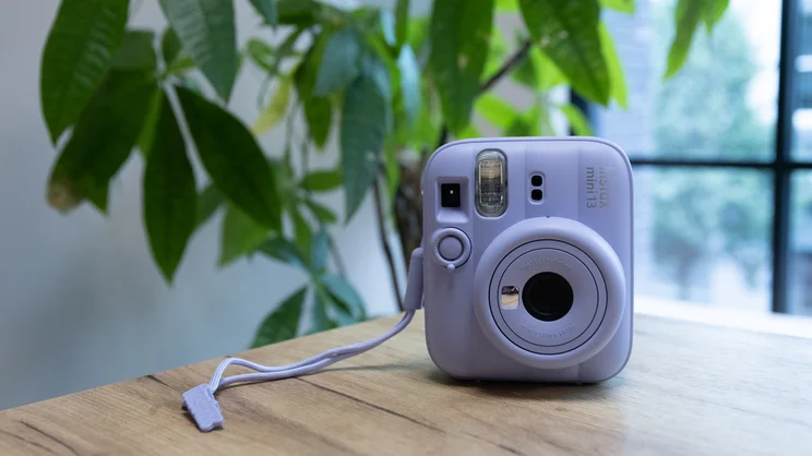 The Instax Mini 13 instant camera on a table in an office