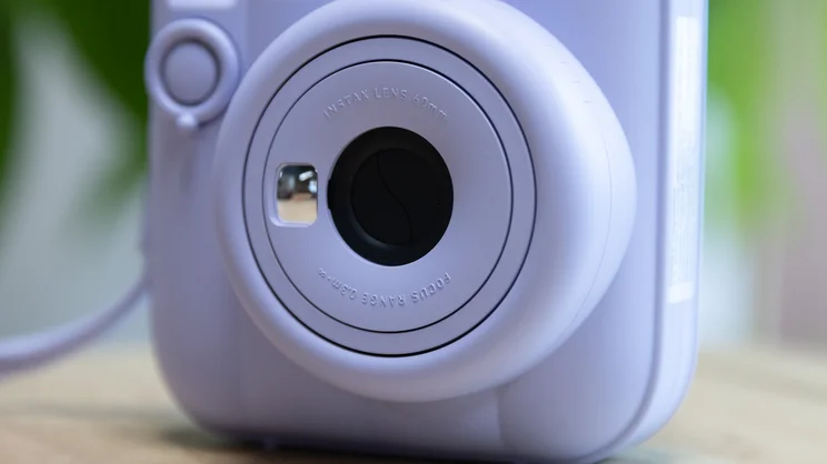 A closeup of the Instax Mini 13 instant camera, with lens closed