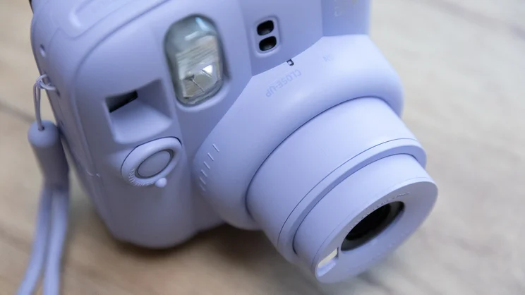 A bird's eye view of the Instax Mini 13 instant camera, with lens extended