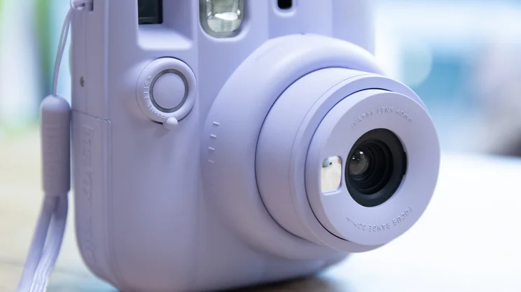 A closeup of the Instax Mini 13 instant camera's extended lens