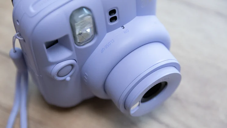 A bird's eye view of the Instax Mini 13 instant camera, with lens extended