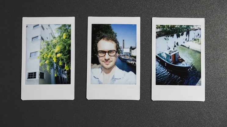 A row of three Instax Mini 13 prints. From left to right: a building and a tree, a selfie above a canal, a canal boat emerging from underneath a bridge