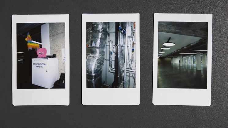 A row of three Instax Mini 13 prints, taken in an office