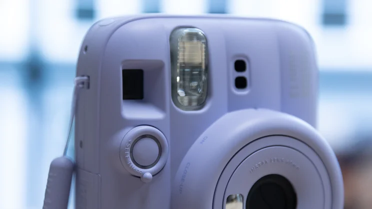 A closeup of the Instax Mini 13 instant camera's flash and shutter button
