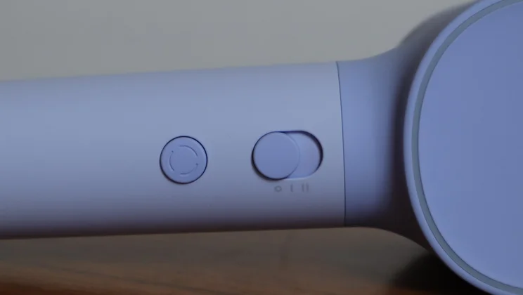 A closeup of the Laifen Neo hair dryer's controls