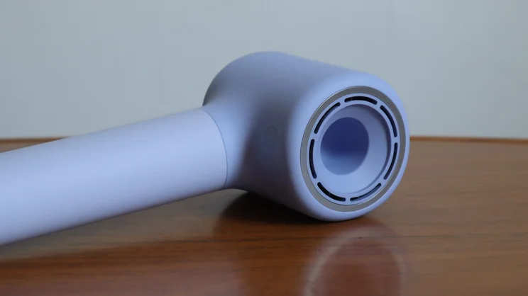 The Laifen Neo hair dryer lying on its side on a table