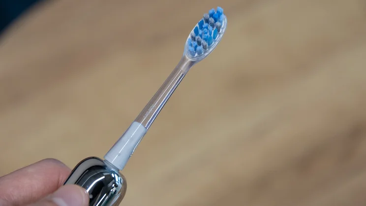 The Laifen Wave Pro electric toothbrush, with its Whitening head attached, in a hand