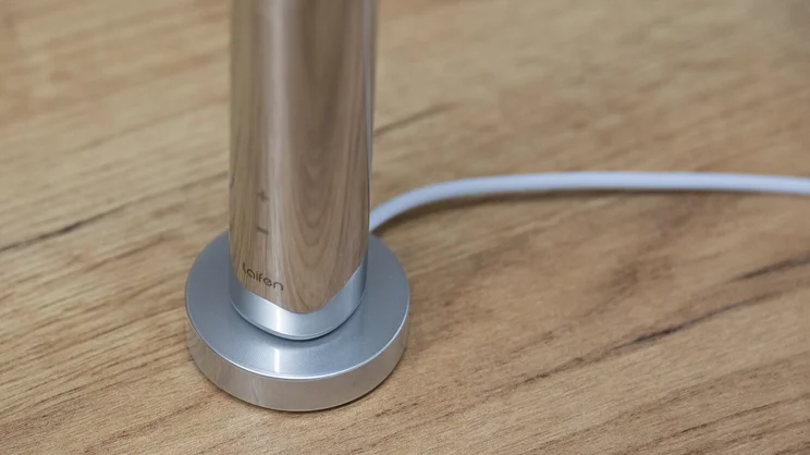 A closeup of the Laifen Wave Pro electric toothbrush on its charging base