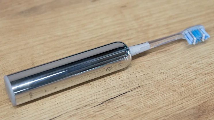 The Laifen Wave Pro electric toothbrush on its side on a table