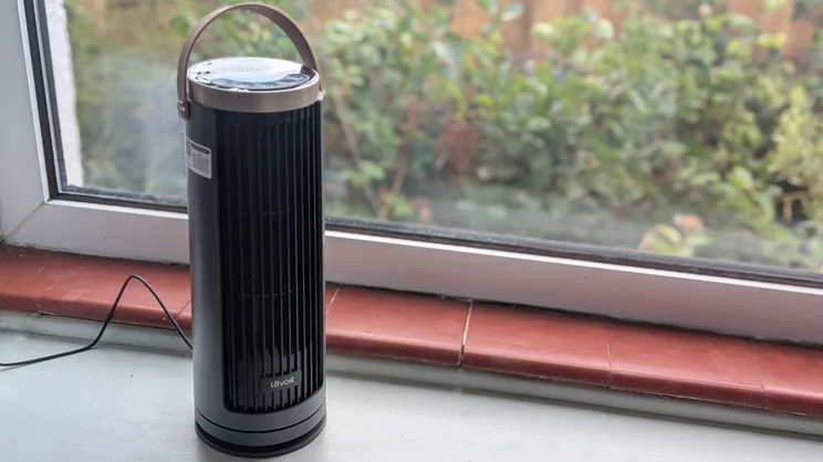 The Levoit Windi Mini Pro fan on a windowsill