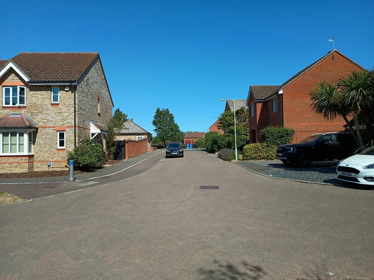 A quiet street with houses on both sides