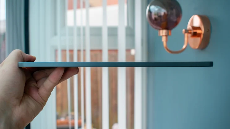 Oppo Pad 5 in hand, side view