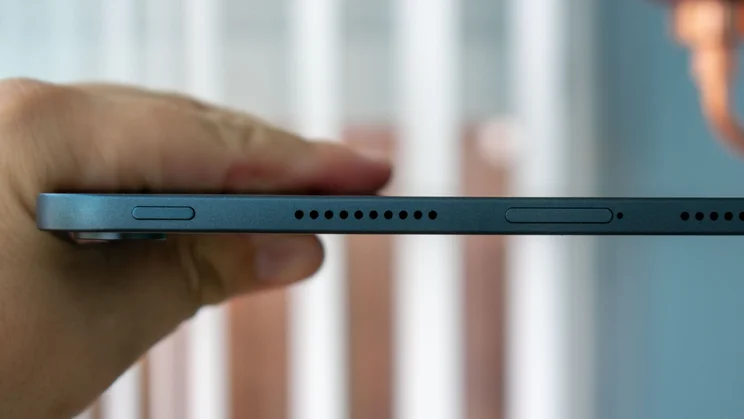 Oppo Pad 5 in hand, showing power button and SIM tray