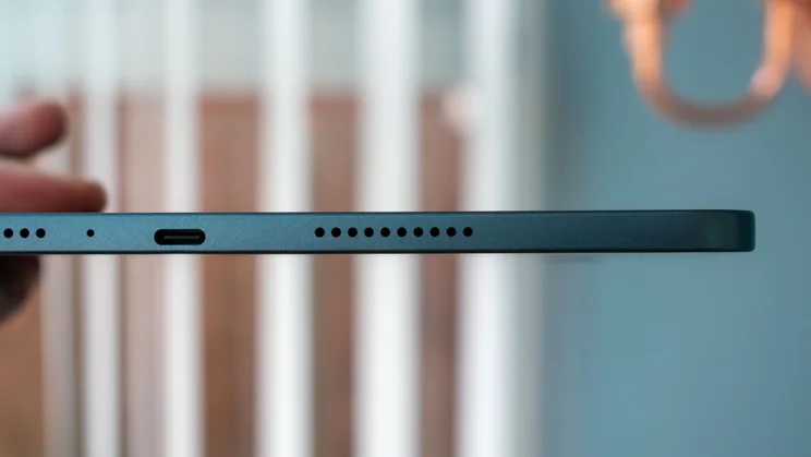 Oppo Pad 5 in hand, charging port and speaker grille