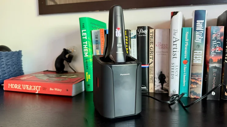 The Panasonic Series 900+ electric shaver in its cleaning dock