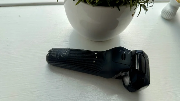 The Panasonic Series 900+ electric shaver on a windowsill