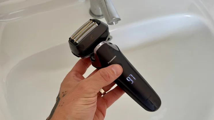 The Panasonic Series 900+ electric shaver held over a bathroom sink