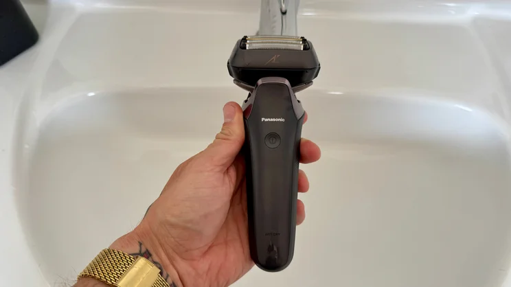 The Panasonic Series 900+ electric shaver held over a bathroom sink