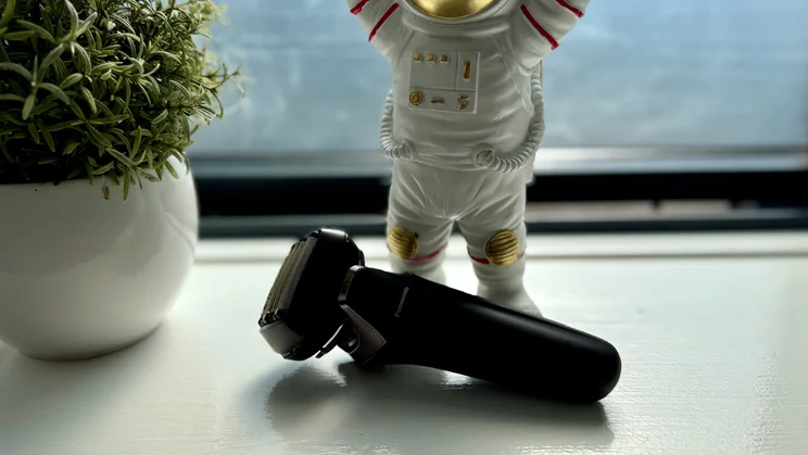 The Panasonic Series 900+ electric shaver on a windowsill