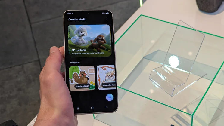 The Samsung Galaxy S26 FE smartphone in a hand, with the Creative Studio app open