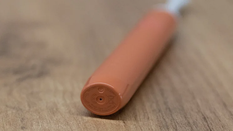 A closeup of the base of the Suri Core 1.0 electric toothbrush