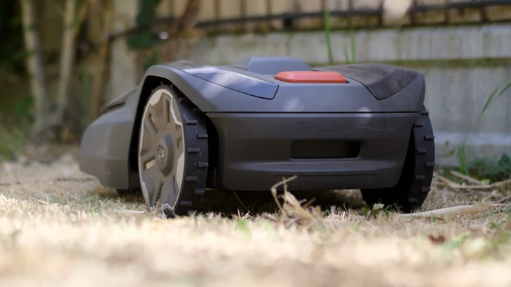 The Husqvarna Automower 308V pictured from the rear off to the left