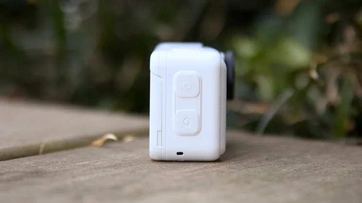 The Insta360 Go Ultra in the dock pictured from the right side